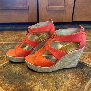 Michael Kors Berkley Coral-Pink fabric t-strap zip wedge sandals.